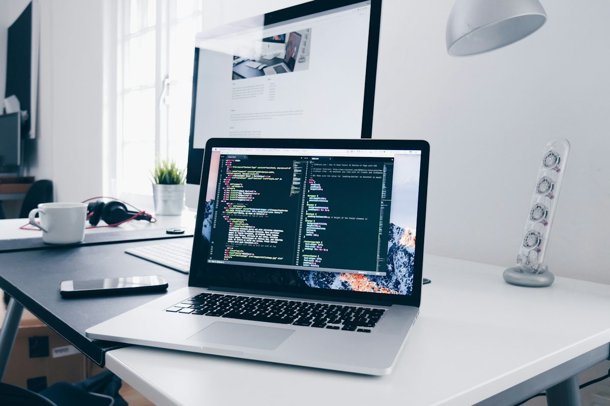 Laptop with code on screen for WordPress theme development